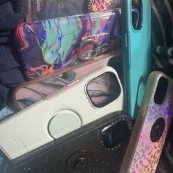 phone cases assorted iphone 13 and iphone 7 and black purse backpack