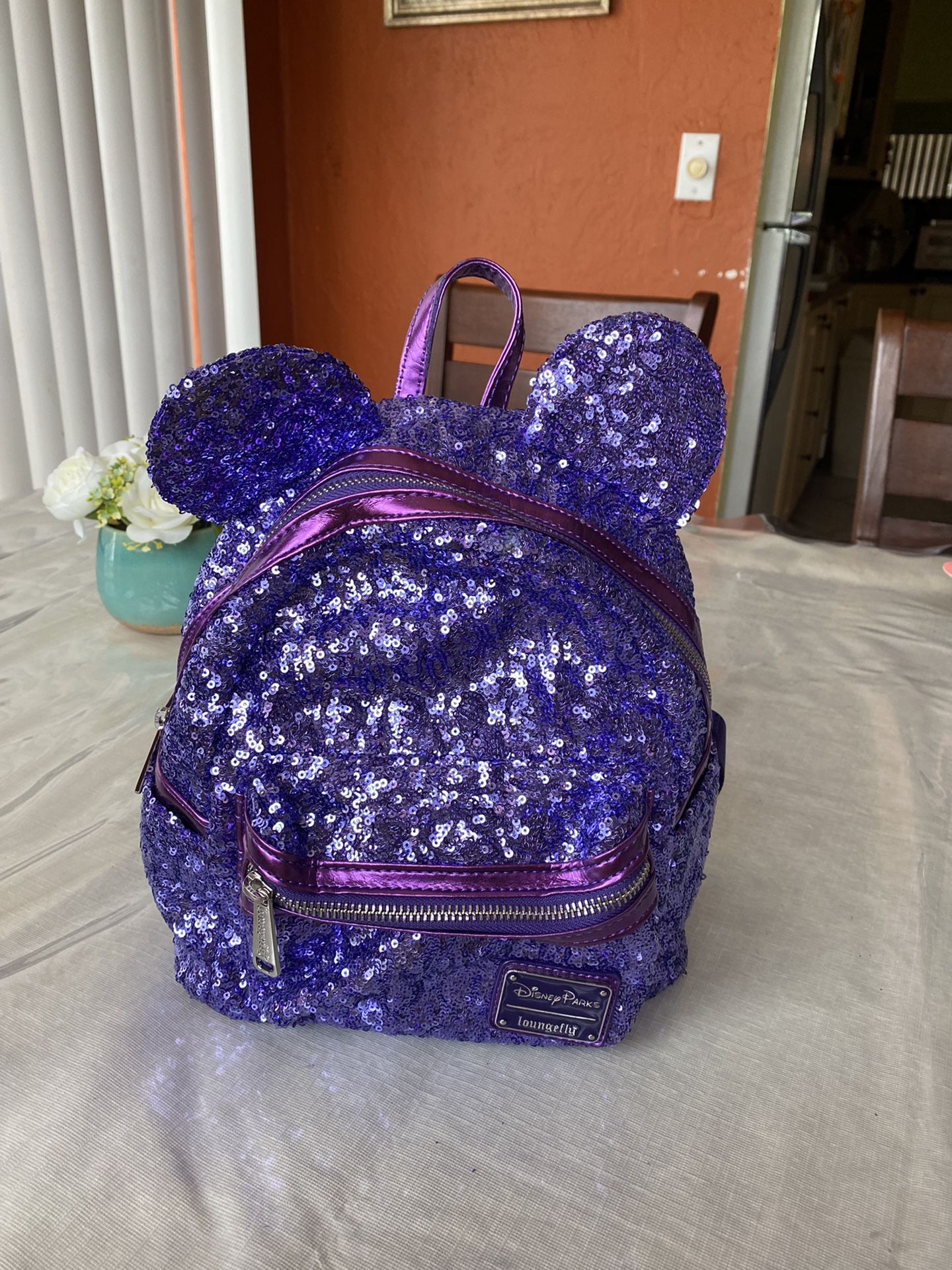 Disney Parks Loungefly Purple Potion Sequined Mini Backpack Mouse Ears CZ.   Used but very good condition 