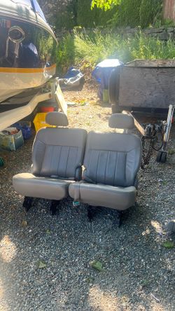Beige/gray bucket seats, bench seats