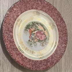 vintage decorative plate by American Limoges, courting couple scene and 22k gold accents