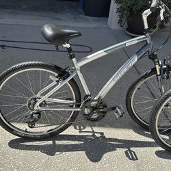 2 Trek bicycles and wall mounts