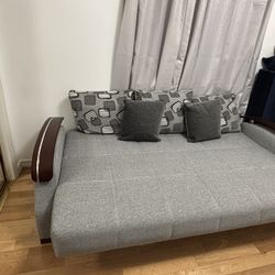 Pull Out Couch Turns Into Bed. Has Storage Spaces As Well 