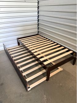 Twin brown wood trundle bed