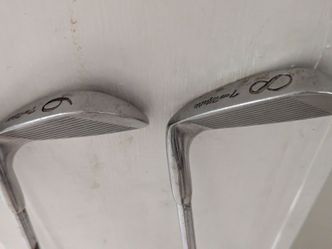Vintage pair of Arnold Palmer Tru-Matic golf irons,