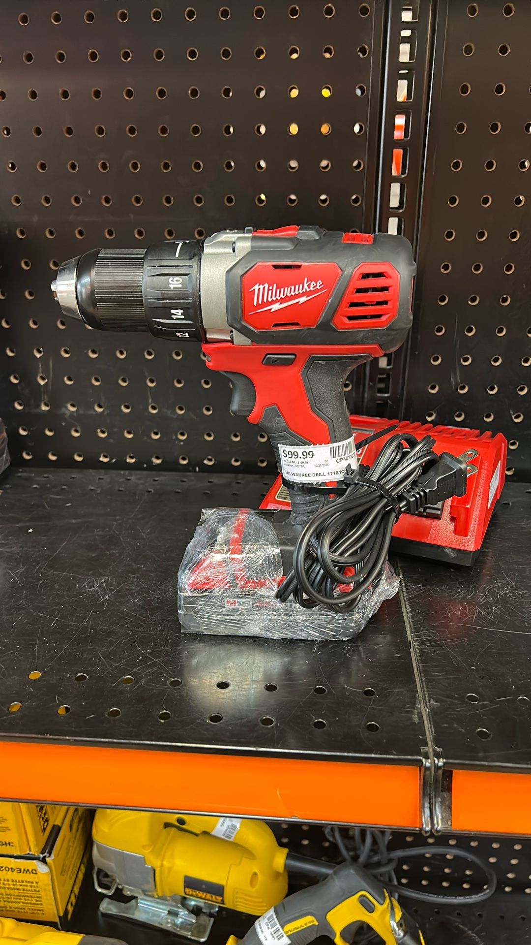 Milwaukee half-inch drill driver with battery and charger