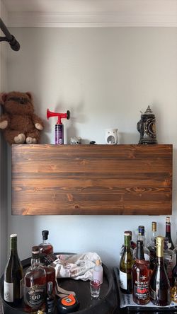 Hiding wood mounted bar or storage