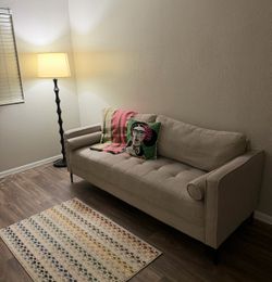 Beige Tufted Sofa with Black Legs