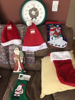 Christmas gifts blankets new different colors 4$ each, Christmas basket 7$ , Christmas clock 12$ ,door crown 5$, Christmas head cover new 3$ Christm