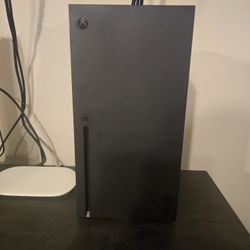 Xbox Series X with standard controller (games and colored controllers sold separately).