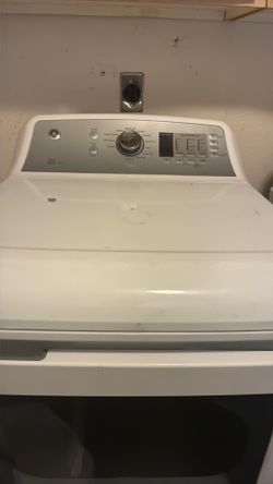 GE WASHER AND DRYER, LG REFRIGERATOR WHITE IN COLOR