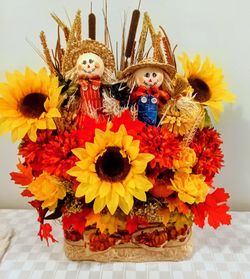 Fall centerpiece with scarecrows. Make me an offer.