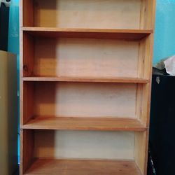 Four Bookshelves Of Various Sizes
