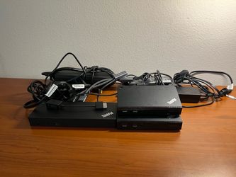 Thinkpad docking stations with AC bricks and cords.