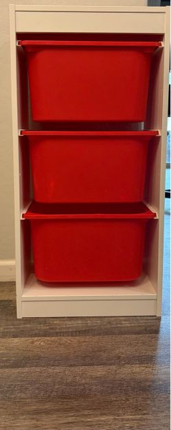 IKEA storage with 3 red tubs