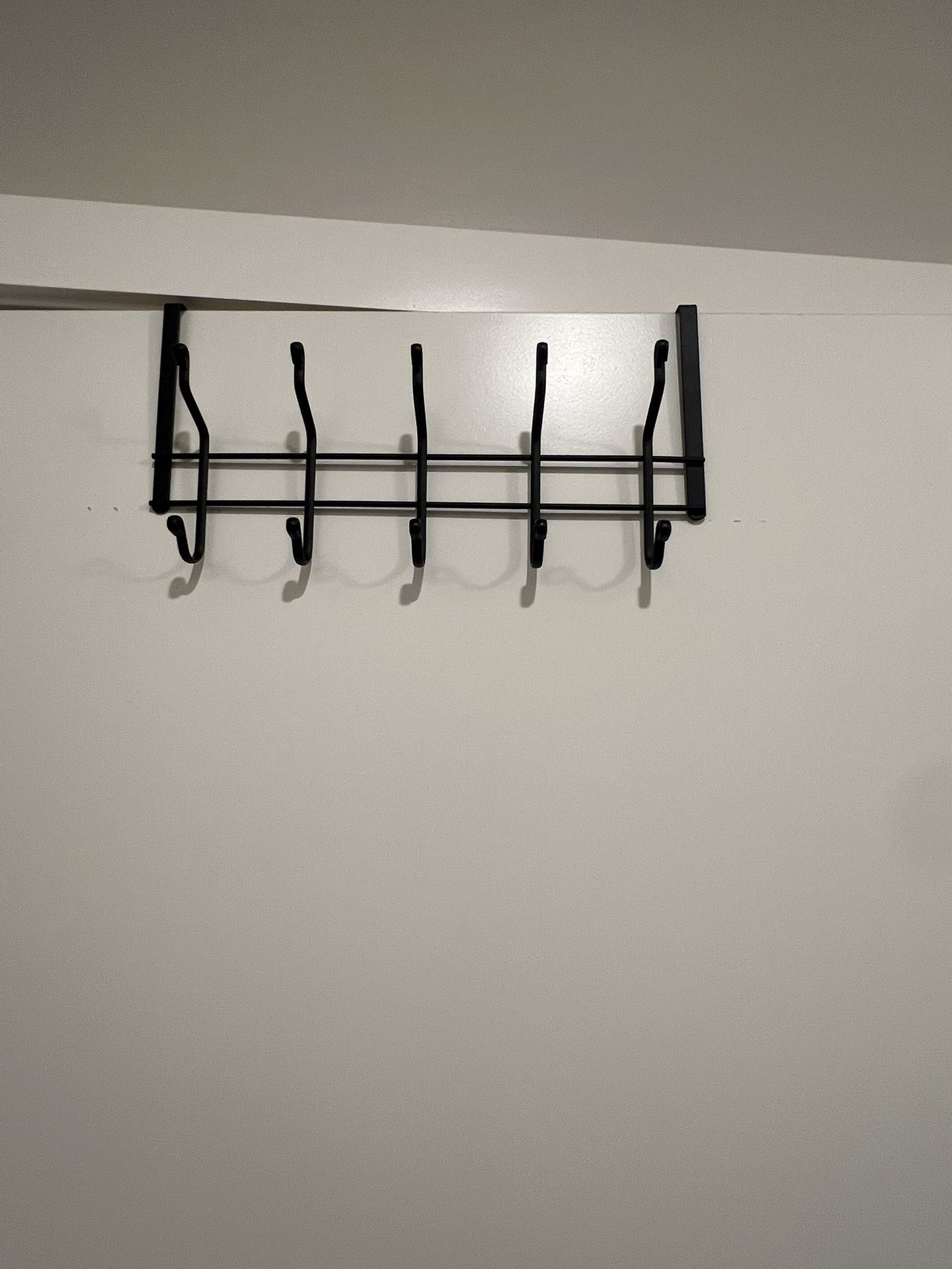 Two door hangers. 10 available hooks. Selling two pieces together. Good condition.