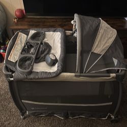 Baby Trend Deluxe II Nursery Center Portable Playard - Misty Gray: Includes Canopy, Bassinet, Vibration, Locking Wheels