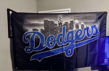 Dodgers flag with city backdrop