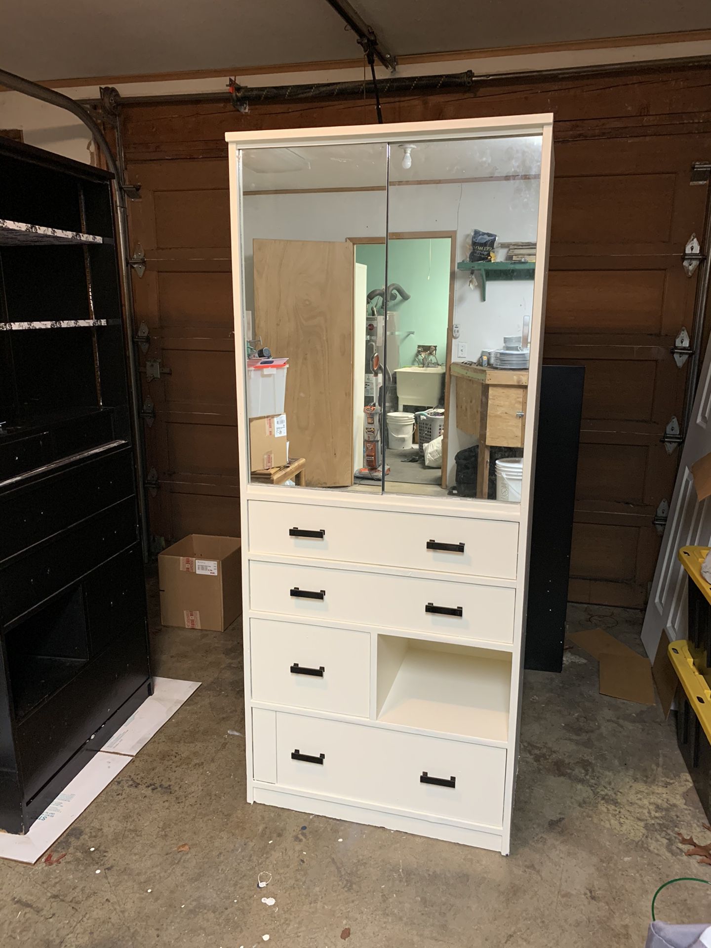 White wood dresser with enclosed shelf top.