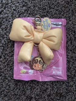 Polly Pocket™ Mystery Bag Puffy Bow We Bag Charm Yellow