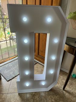 Marquee letter D