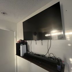 55” Tv with speaker and base
