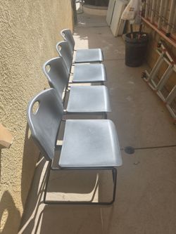 Set of 4 Gray Plastic Stackable Chairs