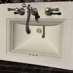 Clean Kohler two-piece toilet. Has the tank, bowl, and seat. White color. Good for a bathroom reno or replacement