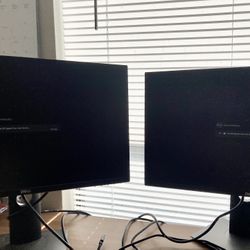 Two Dell Monitors with Lightening Docking Station 