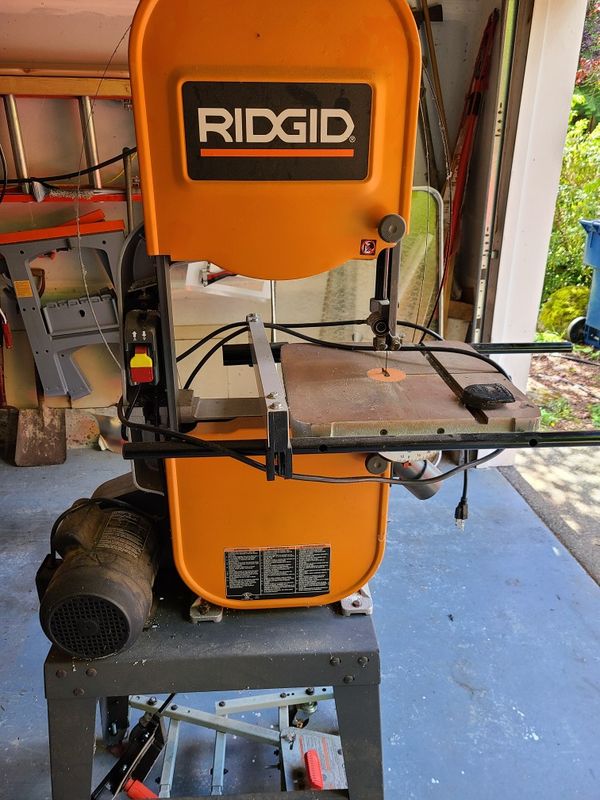 Ridged band saw on rolling stand with 2 extra blades for Sale in