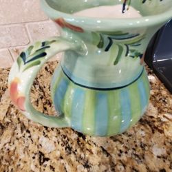 48 oz ceramic pitcher. Never used for liquids. Just a display item. Approx 8x8