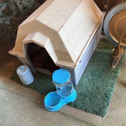 Large doghouse with dog feeder and treat container