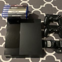 PlayStation 4 With Games And Controllers
