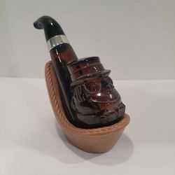 Vintage Avon Amber Glass Leprechaun Pipe Leather After Shave in Craddle, Empty
