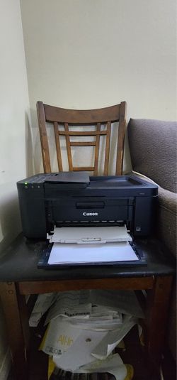 Canon printer with ink and papers