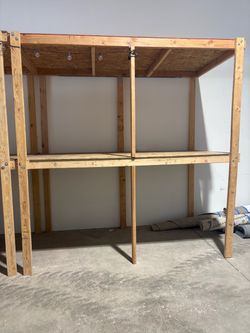5 wooden warehouse shelf units with center supports