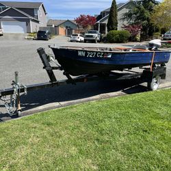 14 Ft Fishing Boat With 9.9 Evinrude Outboard And Trailer