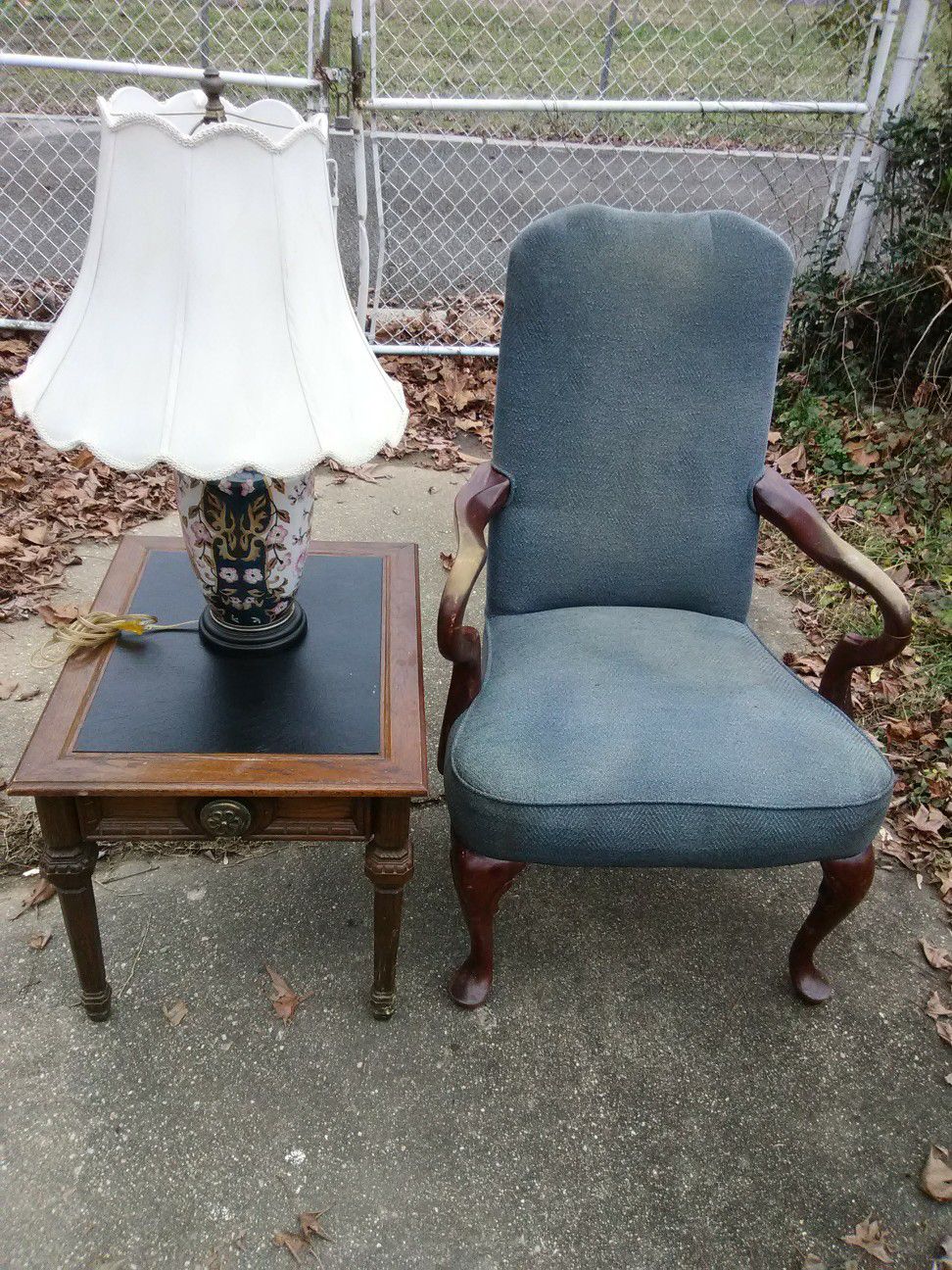 Antique chair with table and lamp