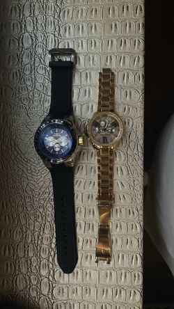 a Micheal Kors Watch and Invicta Watch