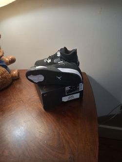 Air Jordan 4 Black and White Sneakers