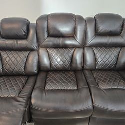 Signature Design by Ashley® Warnerton Chocolate Power Reclining Sofa with Adjustable Headrest