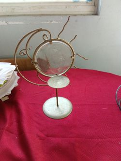 I Have A Candle Stand When You Put A Candle Figure Behind It With Clothes And Shadows Of A Baby With Stars And Also A Towel