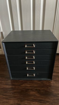 small multi-drawer storage cabinet, often sold as:  * a craft organizer * a desktop filing cabinet * a photo or scrapbook supply organizer * a jewelry