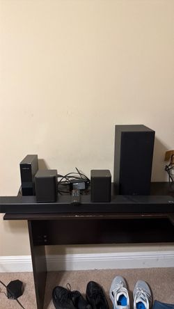LG SL5Y wireless sound bar with surround speakers