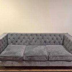 Grey Upholstered Couch in good condition. Pick up only!