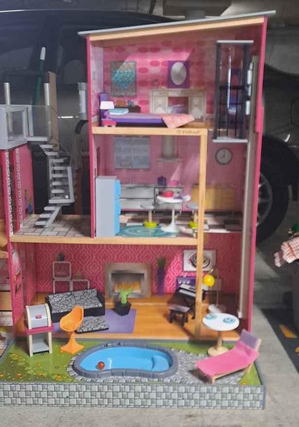 The KidKraft Uptown Dollhouse And Accessories