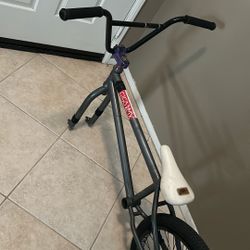custom bmx bike frame handlebars and saddle with a rear wheel