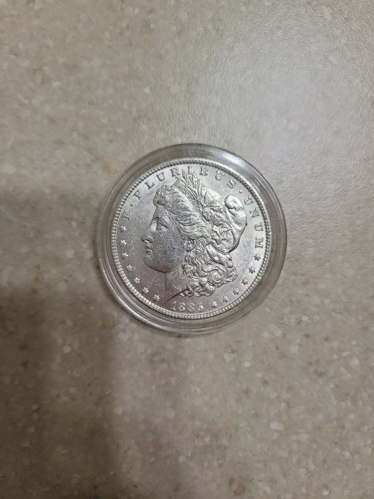 1885 Morgan Silver Dollar. AU