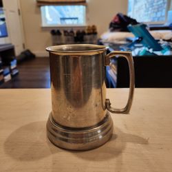 vintage Playboy Club pewter or aluminum tankard mug featuring the iconic rabbit head logo and a clear glass bottom, good condition