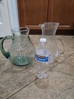 2 glass pitchers $10