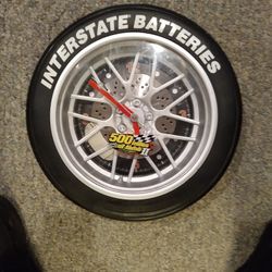INTERSTATE  BATTERIES WALL CLOCK JUST A WALL DECORATION CLOCK WONT RUN STILL COOL LOOKIN. 